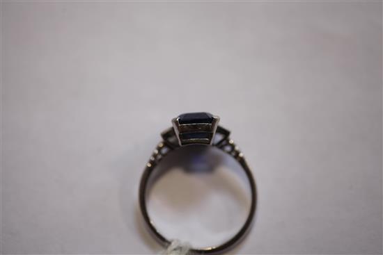 A mid 20th century platinum, sapphire and diamond ring, size 0.